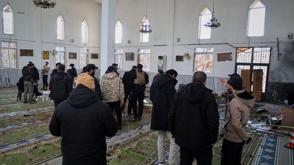 Syrian security forces inspect the damage after an explosion in the Imam Ali bin Abi Talib Mosque in a predominantly Alawite area of the Wadi al-Dhahab neighborhood in Homs, Syria Friday, Dec. 26, 2025.(AP Photo)