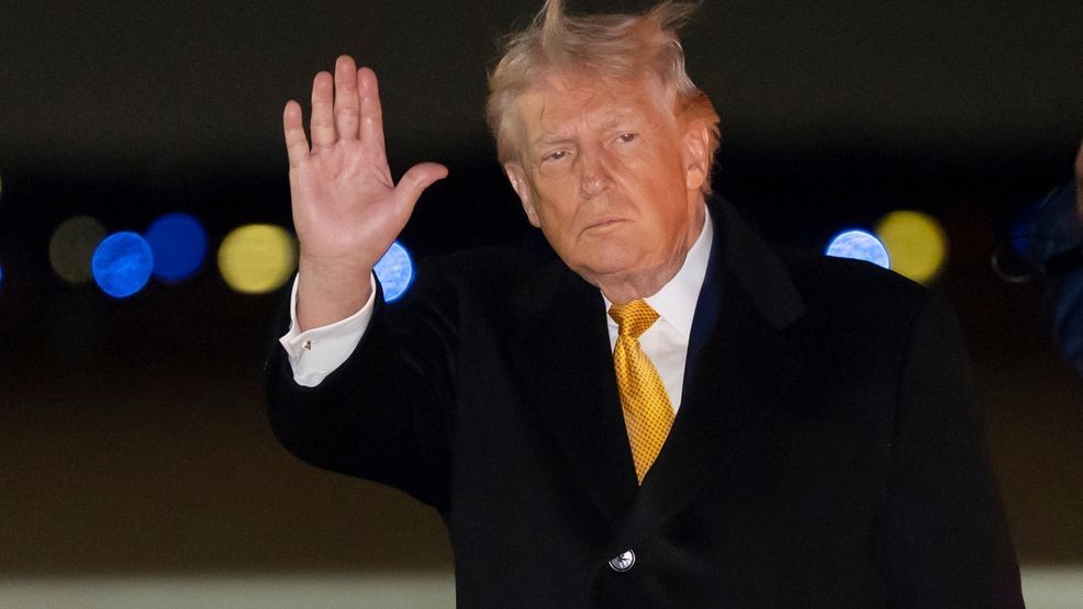 President Donald Trump waves as he arrives on Air Force One, Sunday, Jan. 4, 2026, at Joint Base Andrews, Md. (AP Photo/Alex Brandon)