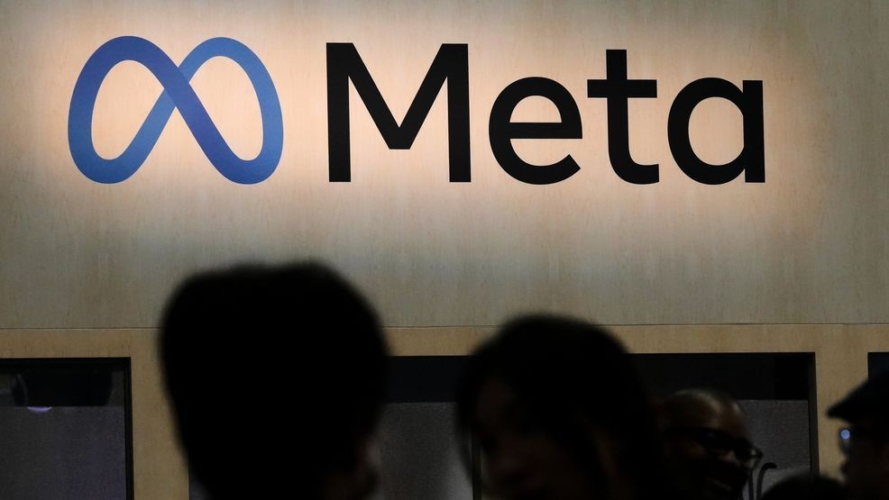 FILE - Attendees visit the Meta booth at the Game Developers Conference 2023 in San Francisco on March 22, 2023. (AP Photo/Jeff Chiu, File)