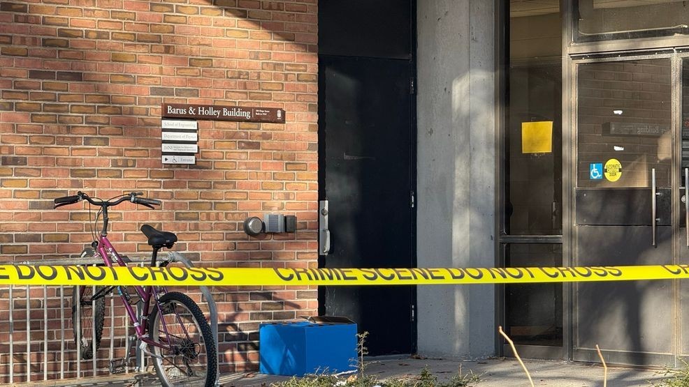Yellow crime scene tape continues to surround the Barus and Holley Building on the Brown University campus, Tuesday, Dec. 16, 2025. (WJAR)