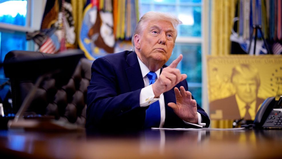 FILE - President Donald Trump takes a question from a reporter before signing executive orders with the Trump Gold Card displayed behind him in the Oval Office at the White House on September 19, 2025. (Photo by Andrew Harnik/Getty Images)
