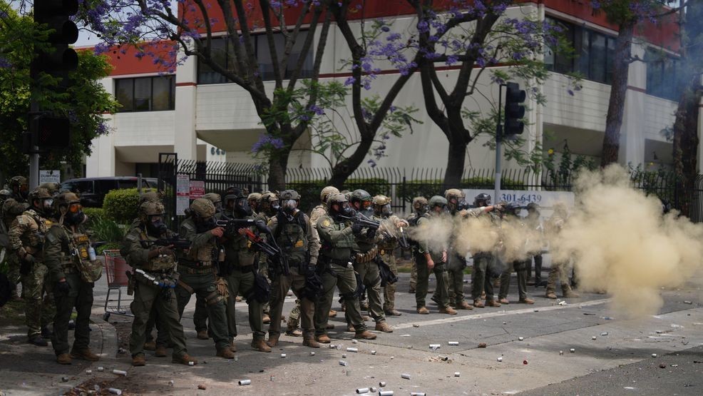 FILE - Border Patrol personnel deploy tear gas during a demonstration over the dozens detained in an operation by federal immigration authorities a day earlier, in Paramount, Calif., June 7, 2025. (AP Photo/Eric Thayer, File)