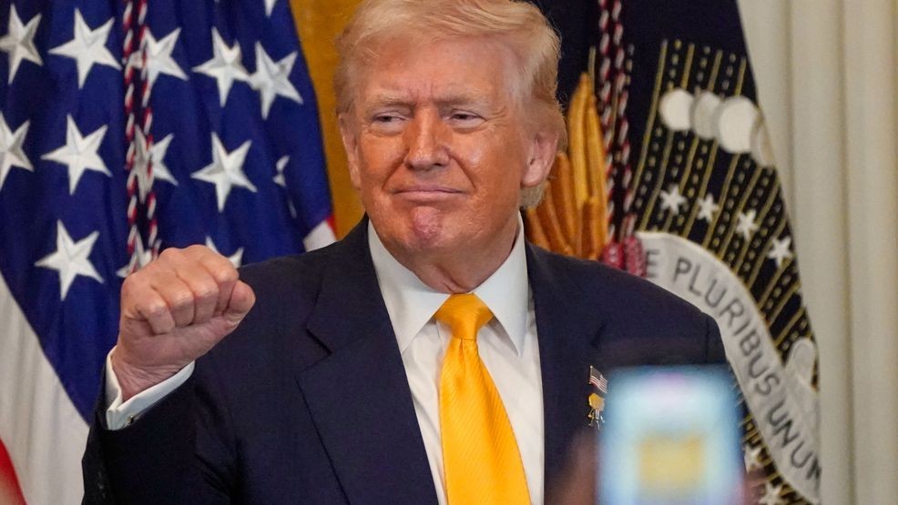 President Donald Trump gestures during a Black History Month event in the East Room of the White House, Wednesday, Feb. 18, 2026, in Washington. (AP Photo/Nathan Howard)