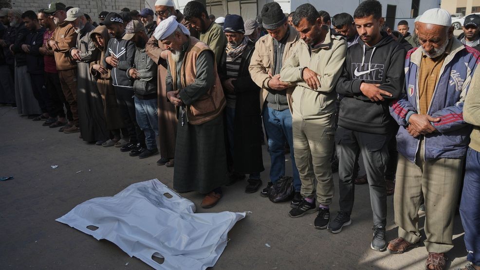Mourners pray beside the body of Iyad Abu Rabi, 3, who was killed when an Israeli strike hit tents sheltering displaced people along the coast of Khan Younis, according to hospital officials, at Nasser Hospital in Khan Younis, Gaza Strip, Monday, Feb. 2, 2026. (AP Photo/Jehad Alshrafi)