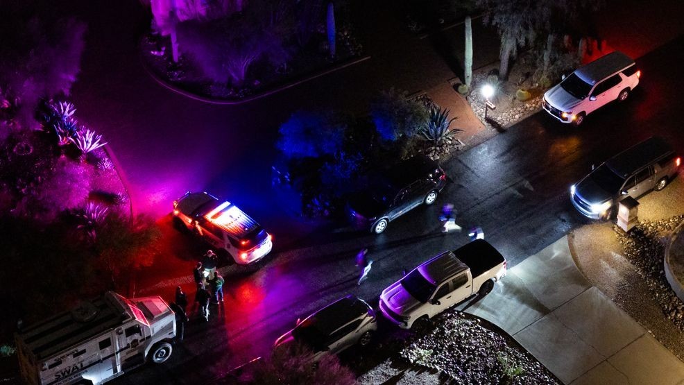 TUCSON, ARIZONA - FEBRUARY 13: In an aerial view, FBI and SWAT units perform operations in a neighborhood approximately two miles from Nancy Guthrie's residence on February 13, 2026 in Tucson, Arizona. Searches continue for Nancy Guthrie, the 84-year-old mother of U.S. journalist and television host Savannah Guthrie, after she went missing from her home on the morning of February 1st.  (Photo by Brandon Bell/Getty Images)