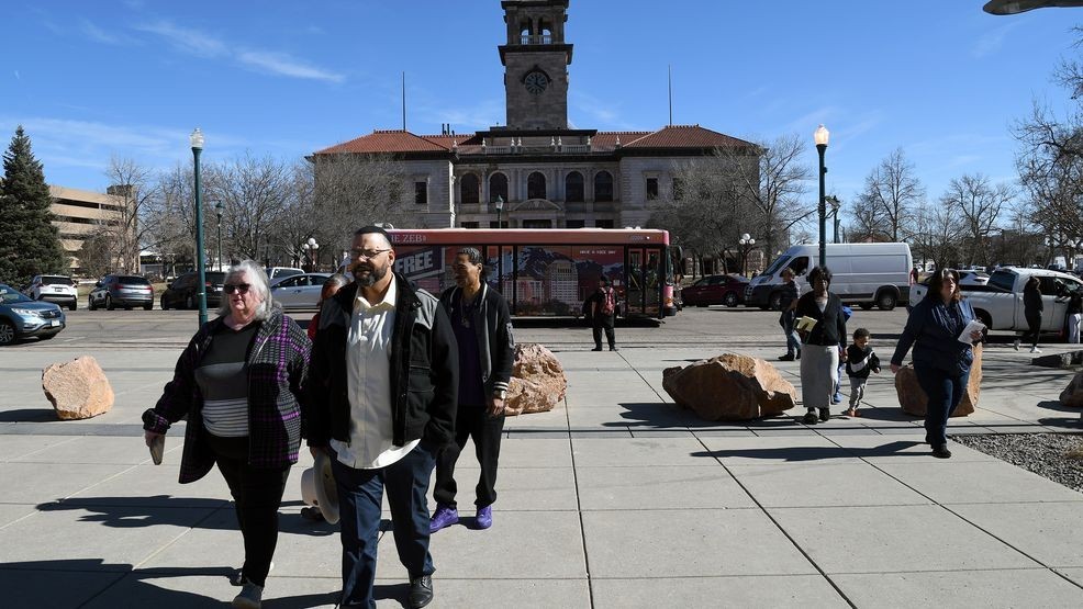 Derrick Johnson, whose mother's body was one of 189 left to decay in the Return to Nature Funeral Home in Penrose, Colo., walks toward the El Paso County Courthouse for owner Jon Hallford's sentencing in Colorado Springs, Colo., Friday, Feb. 6, 2026.  (AP Photo/Thomas Peipert)
