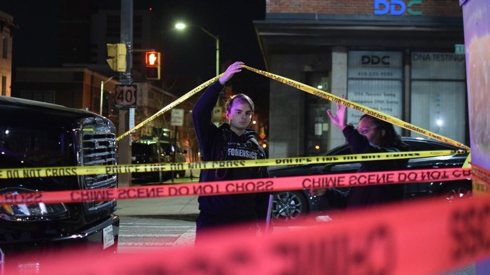 Crime lab technicians collect evidence at the site of an officer-involved shooting in downtown Baltimore{ }on Jan. 7, 2026. (WBFF / Maggie Ybarra){p}{/p}