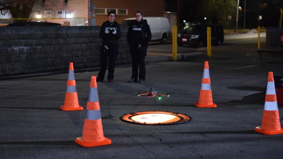 Crime lab technicians retrieve a drone after using it to film a crime scene in east Baltimore on Saturday (WBFF / Maggie Ybarra)