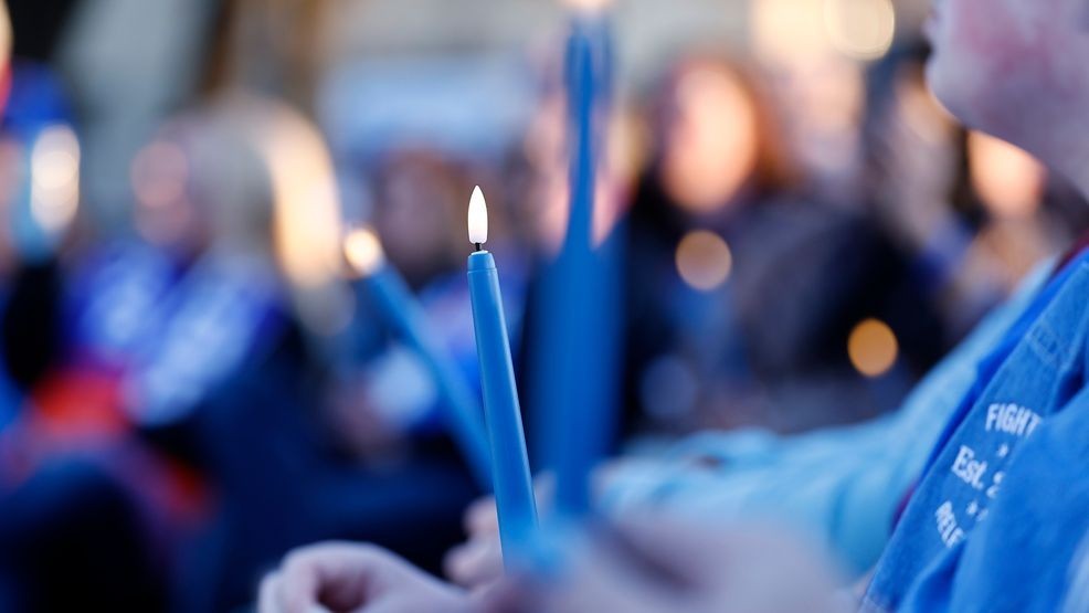 FILE - Cancer survivors, loved ones, and colorectal cancer advocates attend a rally at the Fight Colorectal Cancer "United in Blue" flag installation on the National Mall to spotlight the rise in young adult Colorectal cancer cases on March 10, 2025, in Washington. (Photo by Paul Morigi/Getty Images for Fight Colorectal Cancer)