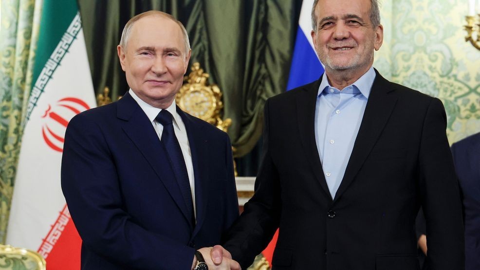 Russian President Vladimir Putin, left, and Iranian President Masoud Pezeshkian pose for a photo during their meeting at the Kremlin in Moscow, Russia, on Jan. 17, 2025. (Vyacheslav Prokofyev, Sputnik, Kremlin Pool Photo via AP, File)