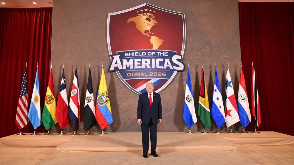 DORAL, FLORIDA - MARCH 07: U.S. President Donald Trump waits to greet dignitaries as he hosts “The Shield of the Americas Summit ,“ a gathering with heads of state and government officials from 12 countries in the Americas at the Trump National Doral Golf Club on March 7, 2026 in Doral, Florida. The White House describes the gathering as a landmark summit aimed at reshaping regional alliances and reinforcing U.S. influence in the Western Hemisphere. (Photo by Roberto Schmidt/Getty Images)