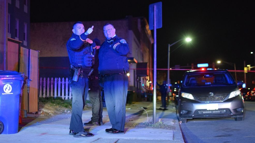 Baltimore police investigate a shooting that injured at least one person in the 300 block of North Gilmor Street on Tuesday. (WBFF / Maggie Ybarra){p}{/p}