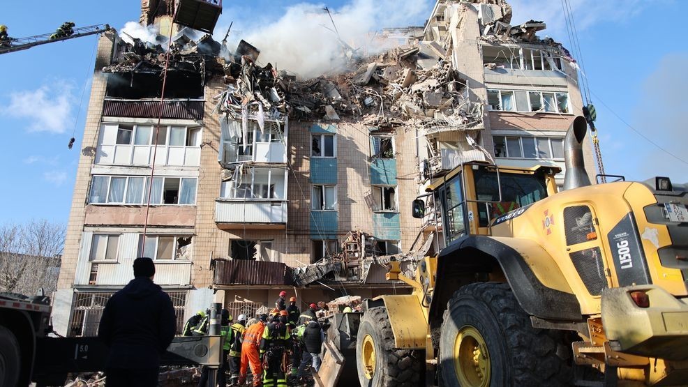 Rescue workers clear the rubble of a residential building which was heavily damaged by a Russian strike on Ternopil, Ukraine, on Wednesday, Nov. 19, 2025. (AP Photo/Vlad Kravchuk)