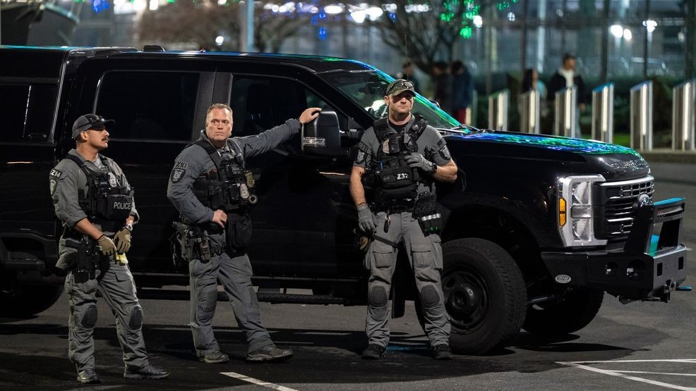 SEATTLE, WASHINGTON - FEBRUARY 8: Police keep watch as Seattle Seahawks fans celebrate near Lumen Field after their team won Super Bowl LX on February 8, 2026 in Seattle. (Photo by David Ryder/Getty Images)