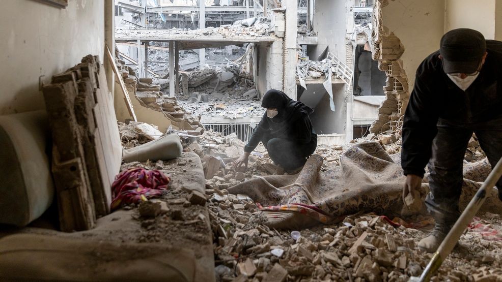 TEHRAN, IRAN - MARCH 15: People sift through the rubble in a house in the Beryanak District after it was damaged by missile attacks two days before, on March 15, 2026 in Tehran, Iran. The United States and Israel continued their joint attack on Iran that began on February 28. Iran retaliated by firing waves of missiles and drones at Israel, and targeting U.S. allies in the region. (Photo by Majid Saeedi/Getty Images)