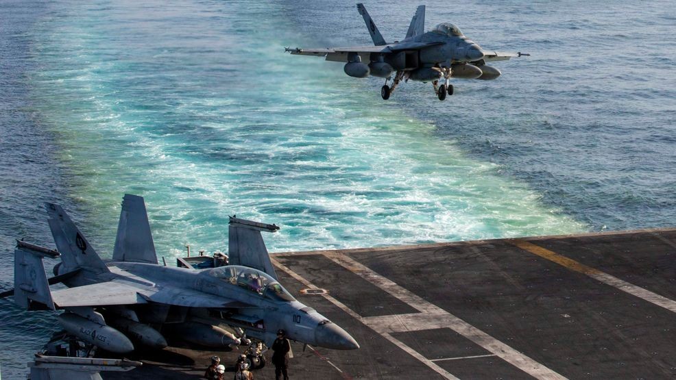 This image provided by U.S. Central Command shows a F/A-18E Super Hornet preparing to make an arrested landing on the USS Abraham Lincoln (CVN 72) after a mission in support of Operation Epic Fury, on Saturday, Feb. 28, 2026. (U.S. Navy via AP)