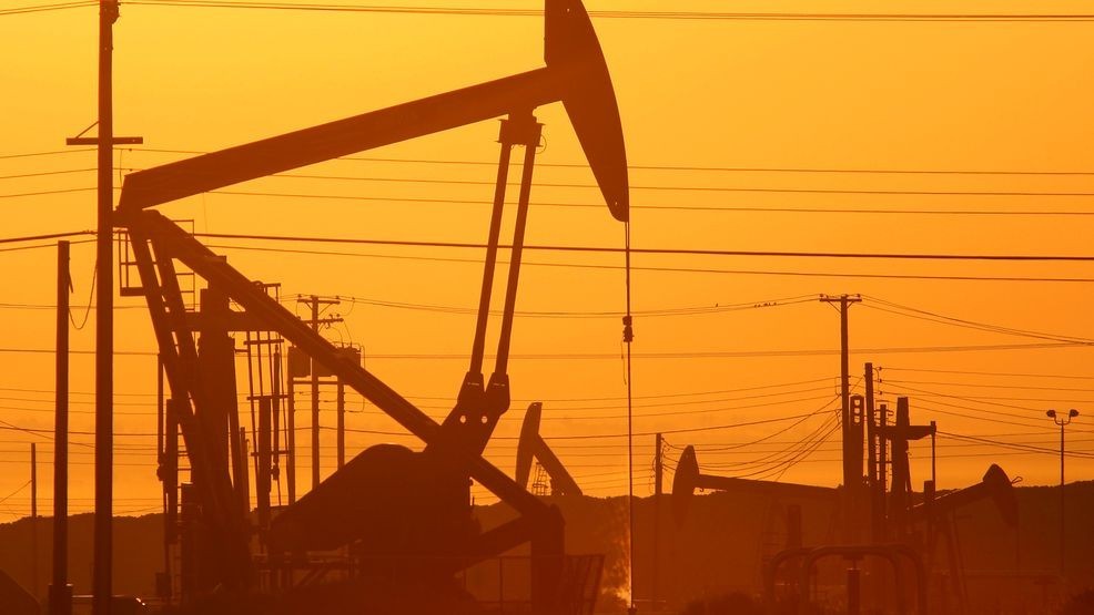 FILE - Pump jacks are seen at dawn in an oil field over the Monterey Shale formation March 24, 2014, near Lost Hills, California. (Photo by David McNew/Getty Images)