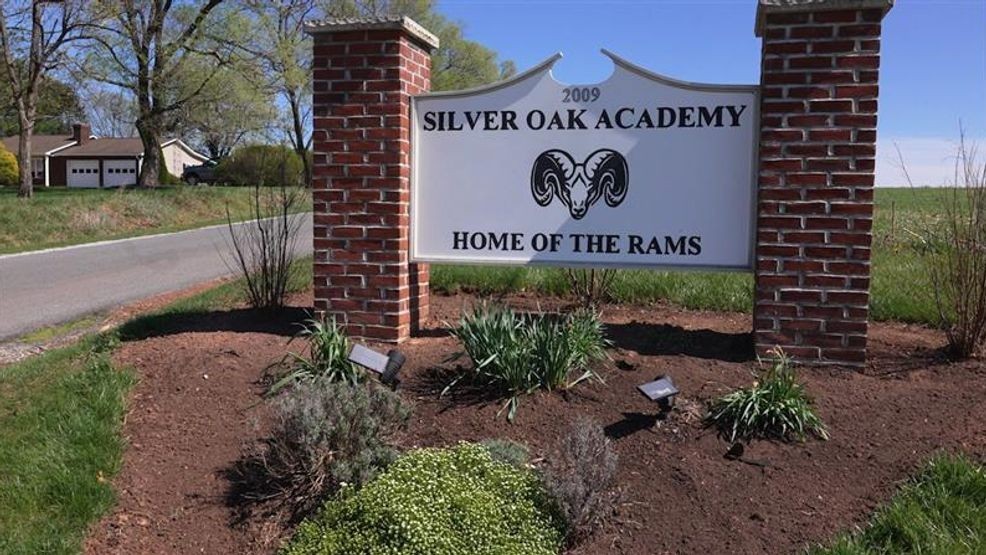 A monument sign sits at the beginning of a mile-long driveway on Tuesday, April 7, 2026, for Nevada-based Rites of Passage's Silver Oak Academy, an alternative, privately operated juvenile foster facility in Carroll County, Md. (Steve Pierce/Spotlight on Maryland)