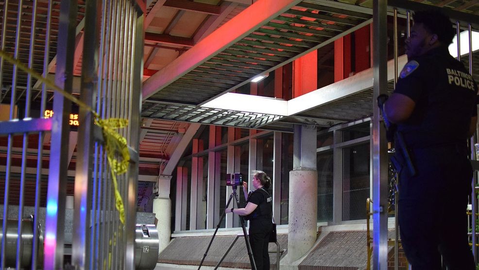 A crime lab technician takes laser images of evidence of a crime inside the Charles Street metro center. (WBFF / Maggie Ybarra)
