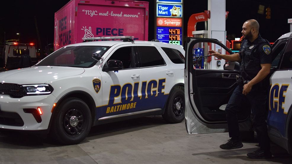 Baltimore police officers watch over a box truck in southeast Baltimore after its driver was detained by authorities on Friday. (WBFF / Maggie Ybarra)