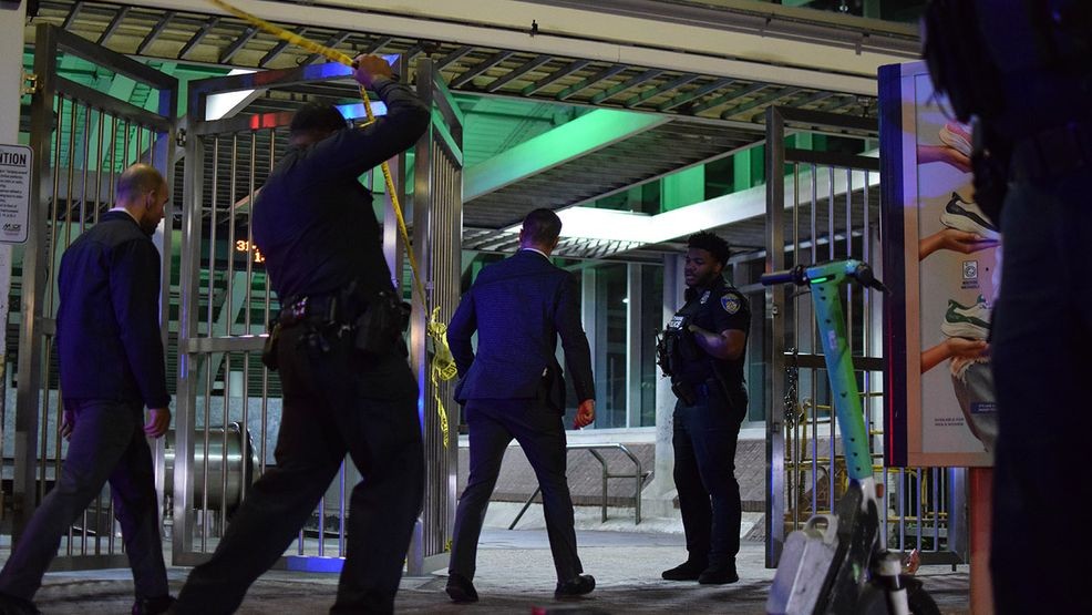 Homicide detectives Sgt. Matthew Tobjy and Rich Klonko walk into the Charles Street metro stop to examine evidence of a violent crime that left a person with life-threatening injuries on Saturday. (WBFF / Maggie Ybarra