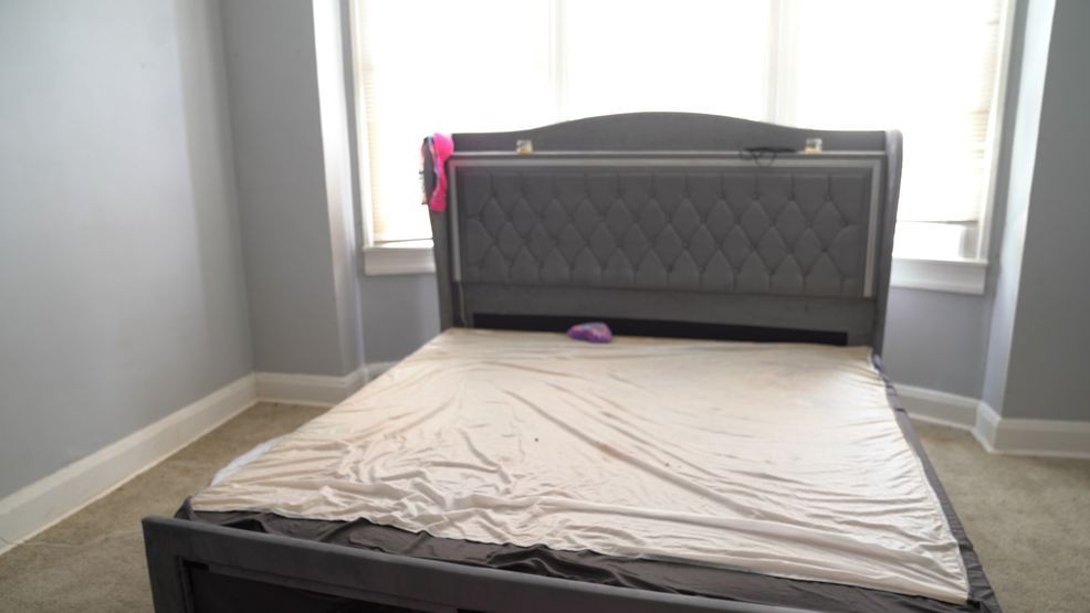 A Baltimore squatter was caught by a property owner with a newly assembled bed, women's lingerie, and a flashing headboard before he removed her. (Zackary Lang/Spotlight on Maryland)