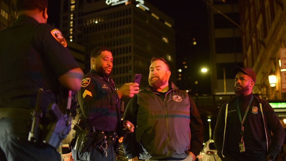 Central District detective Timothy Bardzik talks to officers about some of the evidence he and other detectives discovered of a violent crime that left a person with life-threatening injuries on Saturday. (WBFF / Maggie Ybarra)