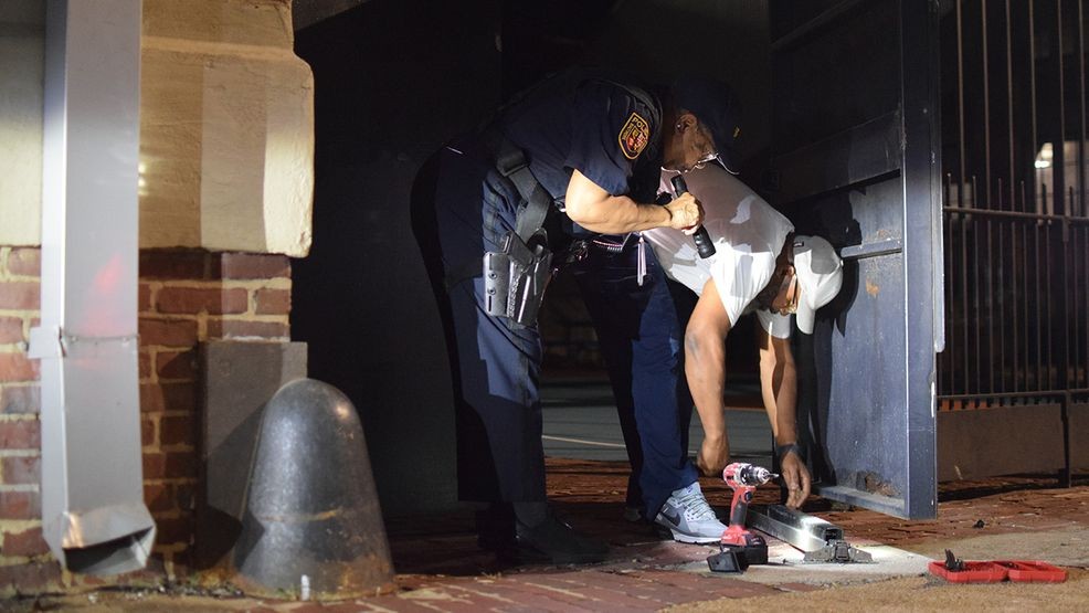School police request repairs to the doors behind the Baltimore Design School following a break-in on Wednesday night. (WBFF / Maggie Ybarra)