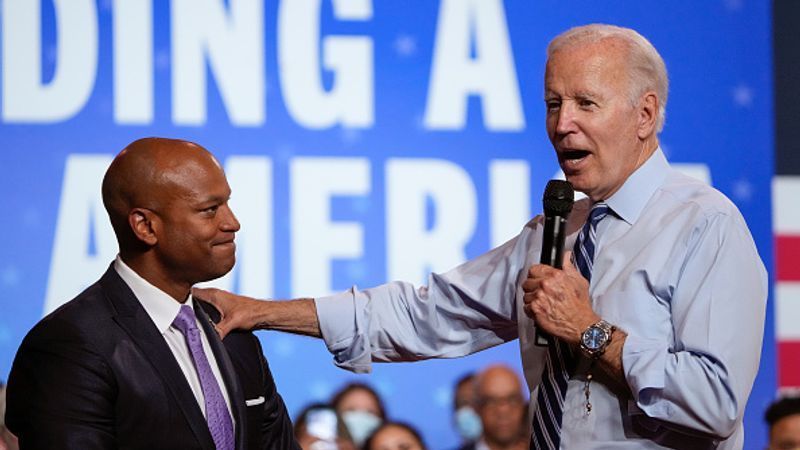 ROCKVILLE, MD - AUGUST 25: U.S. President Joe Biden (R) reaches out to Maryland Democratic gubernatorial candidate Wes Moore while speaking at a DNC rally at Richard Montgomery High School on August 25, 2022 in Rockville, Maryland. Biden rallied supporters for Democratic candidates running in Maryland and to encourage Democratic voters nationwide to turn out in the November midterm elections. (Photo by Drew Angerer/Getty Images)