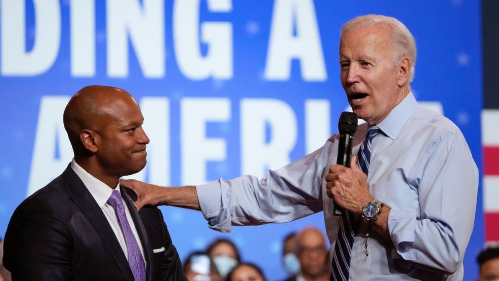 ROCKVILLE, MD - AUGUST 25: U.S. President Joe Biden (R) reaches out to Maryland Democratic gubernatorial candidate Wes Moore while speaking at a DNC rally at Richard Montgomery High School on August 25, 2022 in Rockville, Maryland. Biden rallied supporters for Democratic candidates running in Maryland and to encourage Democratic voters nationwide to turn out in the November midterm elections. (Photo by Drew Angerer/Getty Images)