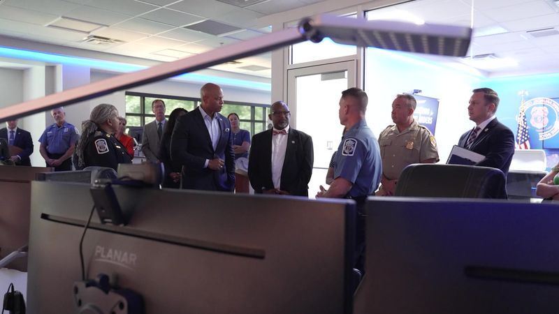 Maryland Gov. Wes Moore, a Democrat, and Del. Gary Simmons, R-Anne Arundel County, speak to Anne Arundel County Police Department leaders on Thursday, July 23, 2026, at the county's Real Time Information Center in Millersville, Md., as part of Moore's ongoing "Delivering for Maryland" tour. (Steve Pierce/Spotlight on Maryland)