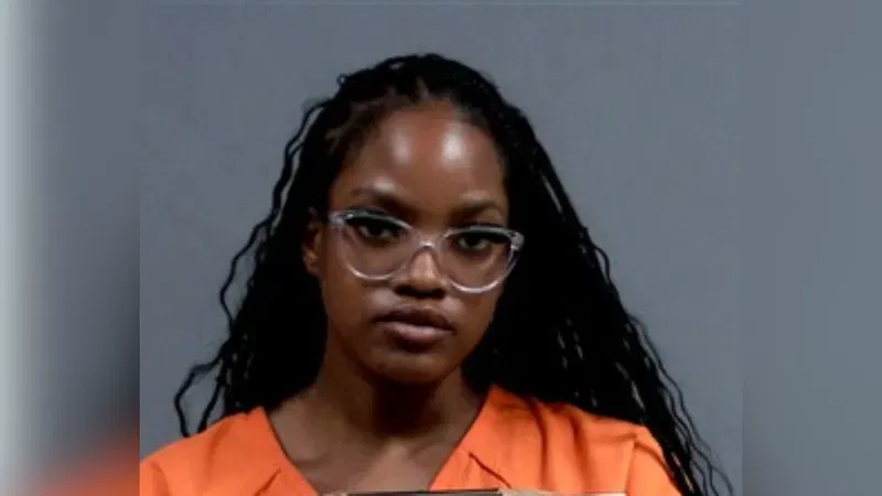 A booking photo for Ja'Niah Johnson, who turned herself into police in Chesterfield County, Va. on Aug. 18, 2026, after police found a man accused of shooting five people at Virginia State University hiding inside a closet in her dorm room. (Chesterfield County Police)