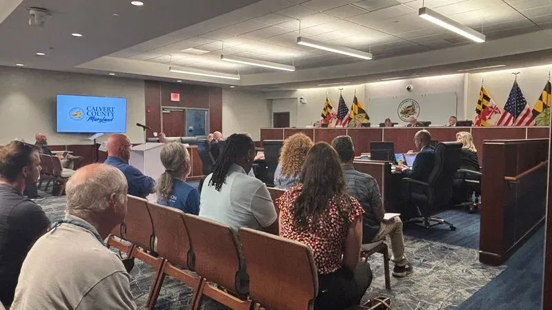 On Aug. 18, 2026, the Calvert County Board of Commissioners hearing room is packed to standing room only ahead of a hearing on a six-month data center moratorium. (Brad Bell/7News)