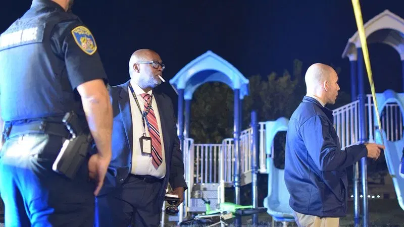 Homicide detective Nigel Rose chews on a cigarette as he and homicide detective Sgt. Matthew Tobjy prepare to walk into a crime scene in Cherry Hill. (WBFF / Maggie Ybarra)