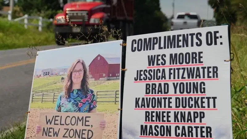 Yard signs denouncing a new Amazon Web Services data center facility under construction in Adamstown, Md., on Thursday, August 27, 2026. (Steve Pierce/Spotlight on Maryland)