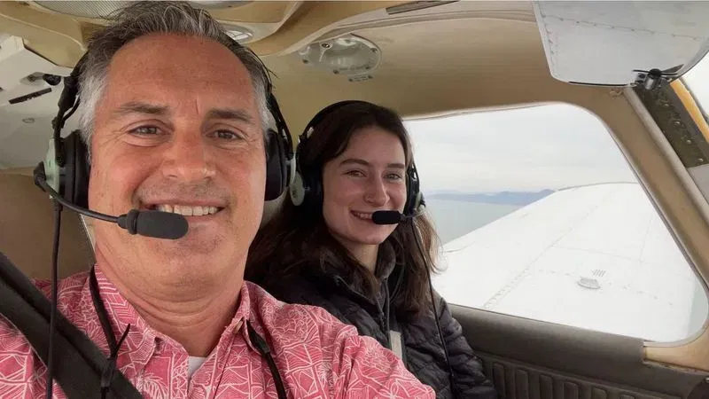 Kenny Katnik, 24, a CommuteAir captain, was preparing to fly to Syracuse on Sept. 1 when she suddenly recognized the voice of her father, United Airlines pilot Kent Katnik, on the same radio frequency. (Katnik Family)