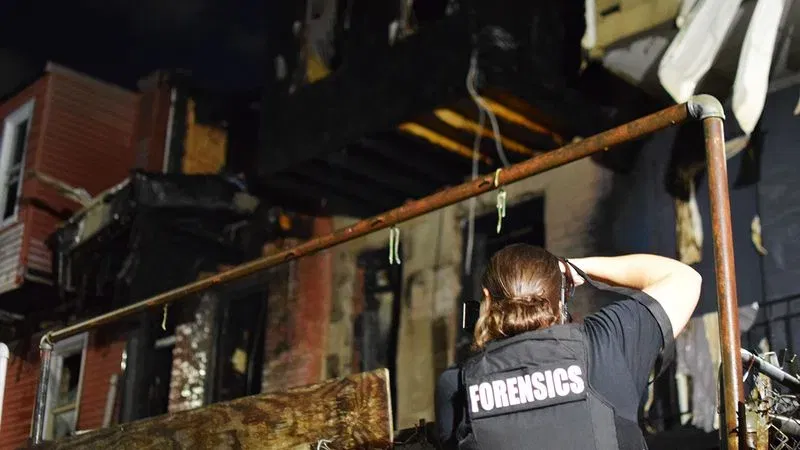 Police investigate a two-alarm fire in McElderry Park on Saturday. (WBFF / Maggie Ybarra)