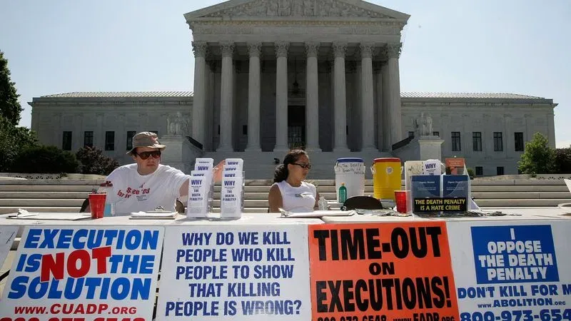 WASHINGTON - JULY 01:  Activists participate in a vigil against the death penalty in front of the U.S. Supreme Court July 1, 2008 in Washington, DC. The Abolitionist Action Committee and the National Coalition to Abolish the Death Penalty held the vigil to abolish the death penalty to mark the 1972 and 1976 Supreme Court rulings suspending the death penalty and later allowing executions to resume.  (Photo by Alex Wong/Getty Images)