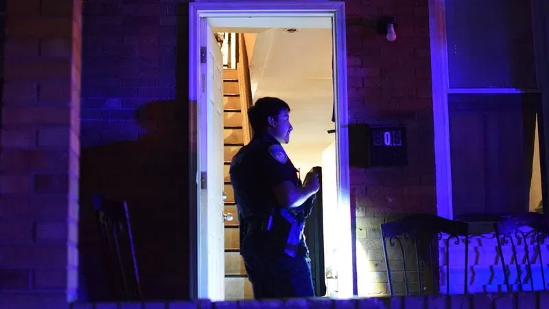 Police search for evidence inside a home in Baltimore Highlands on Wednesday night. (WBFF / Maggie Ybarra)