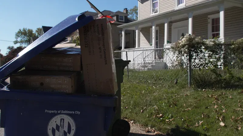 Boxes bearing the shipping label 'Treasure of Life Assisted Living' were stacked outside a home in the 5500 block of Hilltop Avenue in Baltimore on Friday, Oct. 23, 2026. Natae Alleyne, the owner of the organization, has come under scrutiny by the Maryland Attorney General's office for operating both licensed and unlicensed assisted living programs. (Steve Pierce/Spotlight on Maryland)