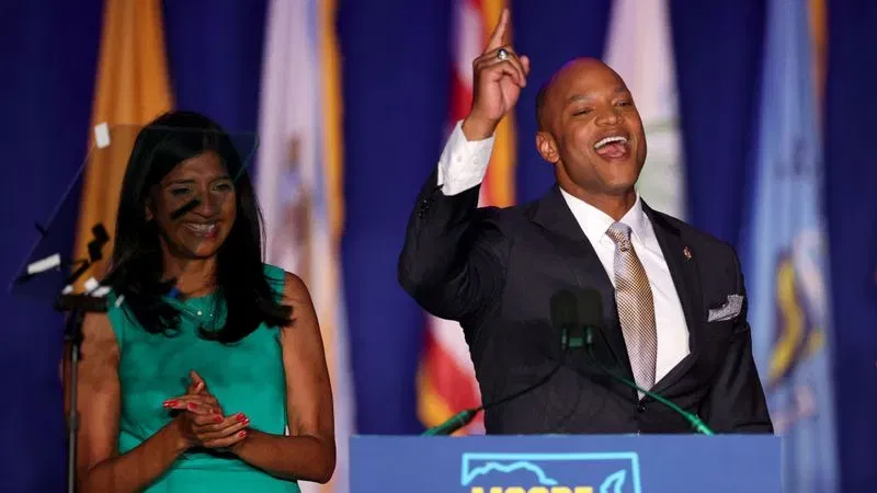 BALTIMORE, MARYLAND - NOVEMBER 08: Democratic Lt. gubernatorial nominee Aruna Miller and Democratic gubernatorial nominee Wes Moore celebrate while addressing supporters after defeating Republican nominee Dan Cox on November 08, 2022 in Baltimore, Maryland. Moore will make history as the state's first Black governor. (Photo by Rob Carr/Getty Images)