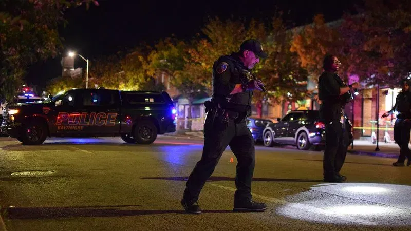 Officers assigned to the Eastern District search for cartridge casings along Belair Road following a shooting on Monday night. (WBFF / Maggie Ybarra)