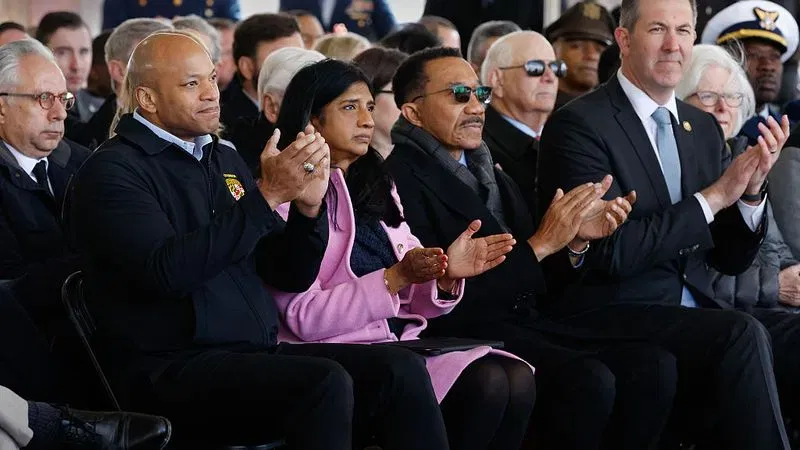 DUNDALK, MARYLAND - MARCH 26: (2nd L-R) Maryland Governor Wes Moore, Lieutenant Governor Aruna Miller, Rep. Kweisi Mfume (D-MD), former Sen. Ben Cardin (D-MD) and Rep. John Olszewski (D-MD) attend a commemoration ceremony on the anniversary of the Francis Scott Key Bridge disaster on March 26, 2025 in Dundalk, Maryland. Six members of a work crew filling potholes on the center span of the bridge were killed when the container ship Dali lost power and collided with the bridge, destroying it and closing the Patapsco River and the Port of Baltimore for weeks. (Photo by Chip Somodevilla/Getty Images)